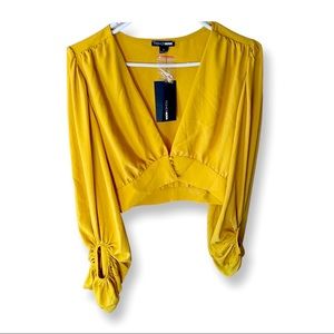 Yellow crop top Flowey  sleeves. Never worn. Tags still attached.